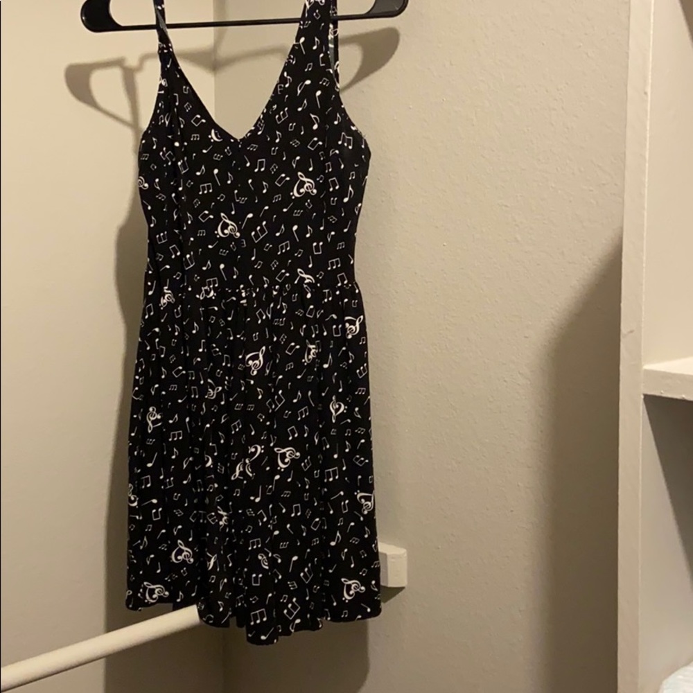 Black skater dress with music pattern